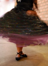 Showing off the swirl of her pollera before the cholita fashion show, El Alto, La Paz.