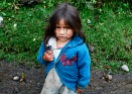 Little girl looking for sweets at the beginning of the Santa Cruz trek, Cordillera Blanca, Peru