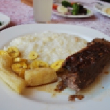Gorgeous braised beef with cheesy rice and plantains - missions region of Bolivia.
